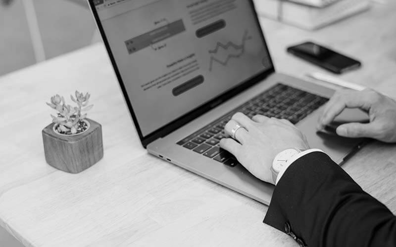 SEO specialist working at a desk with analytics dashboards